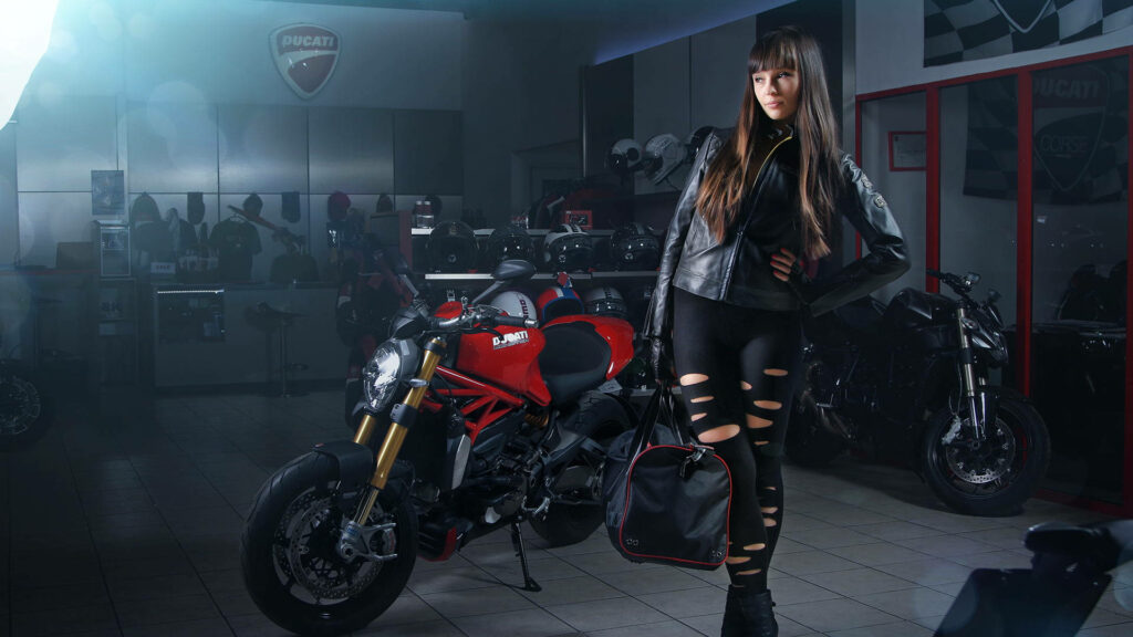 Sleek Ducati Motorcycle & Biker: Dynamic Wallpaper Background