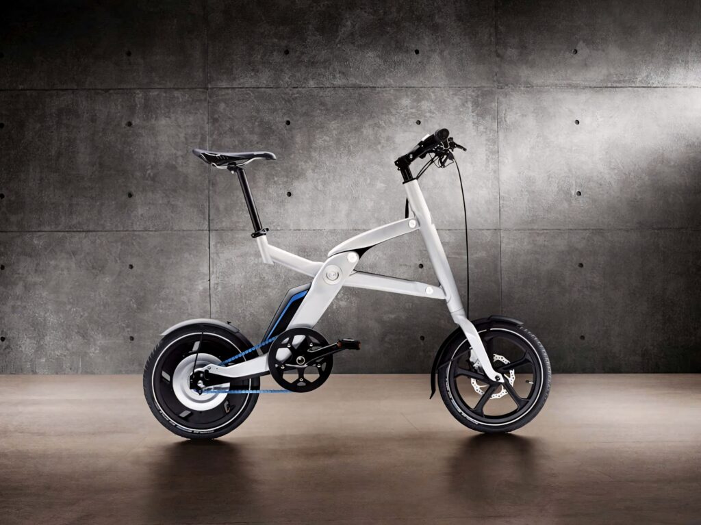 Sleek electric bike with white frame and black accents on industrial concrete background wallpaper