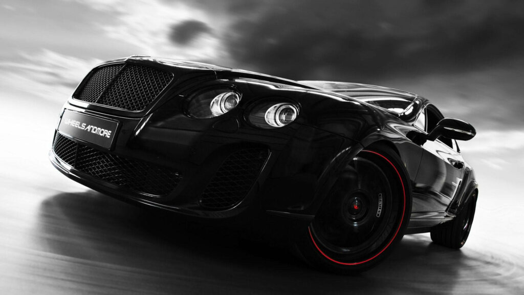 Luxurious Elegance: Red Accents Enhance the Stunning Front Profile of a Classy Black Bentley Continental GT Wallpaper