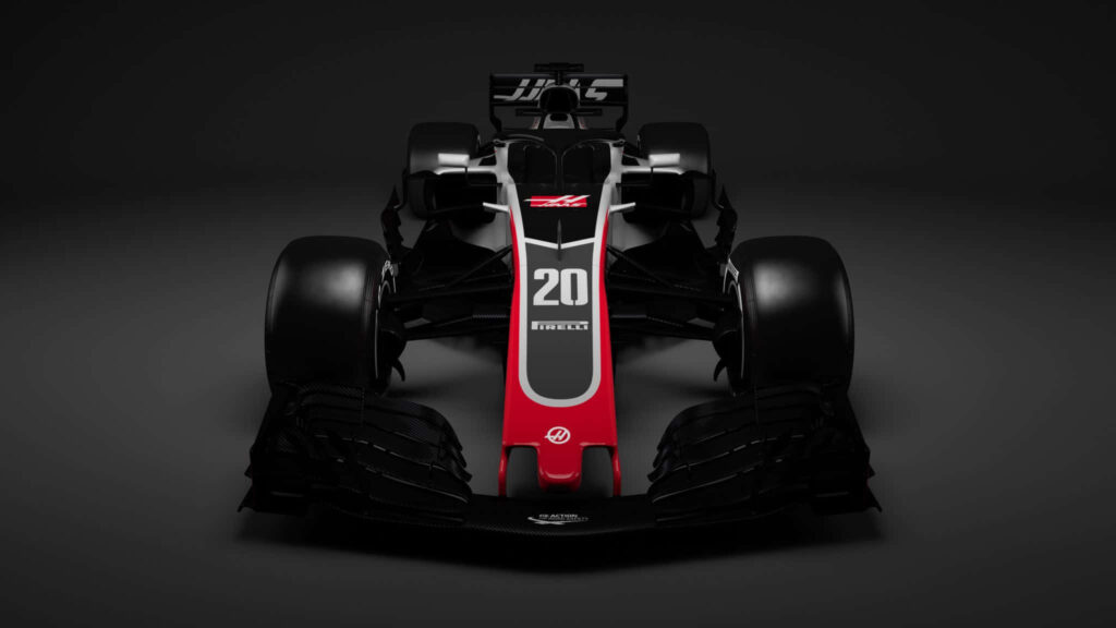 Sleek F1 2018 car with red and black livery on dark background high speed Formula 1 racing wallpaper