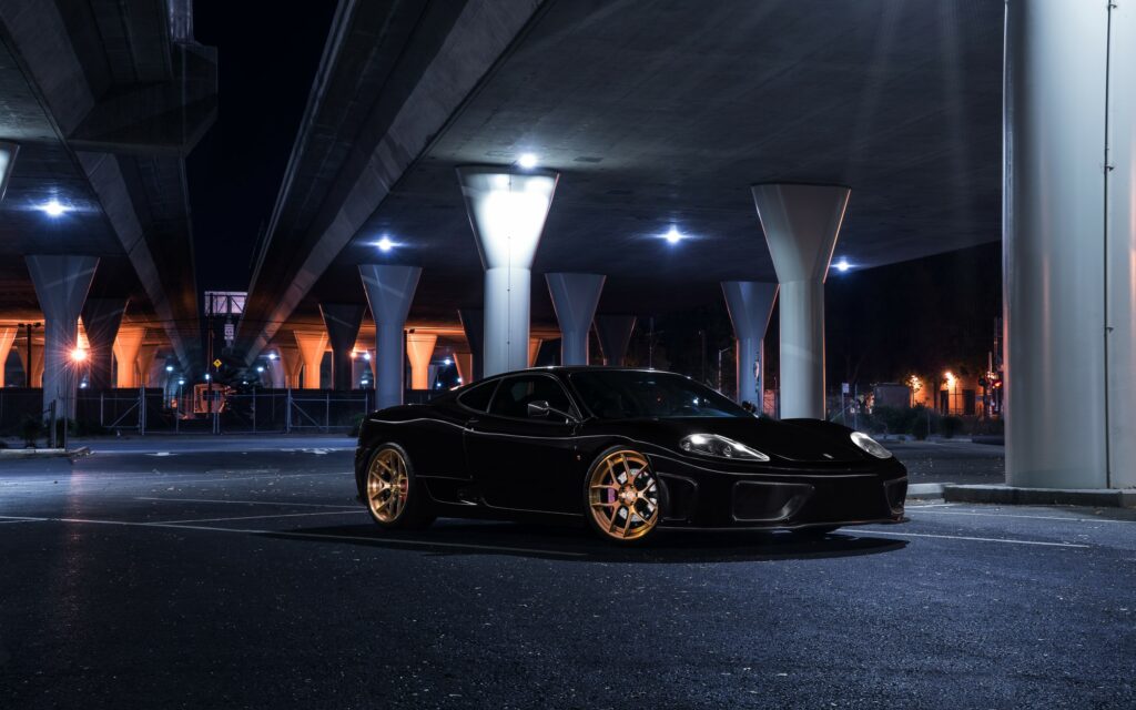 Sleek Ferrari 360 Modena in Urban Light - Elegant Wallpaper