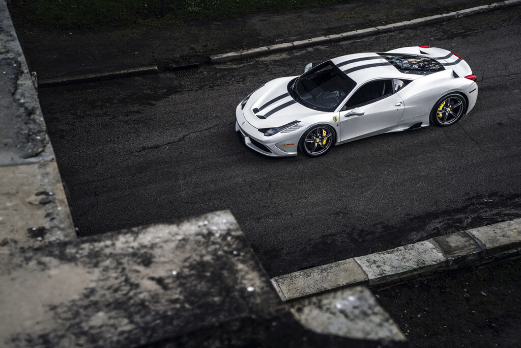 Sleek Ferrari 458 Wallpaper: White Exterior & Black Racing Stripes
