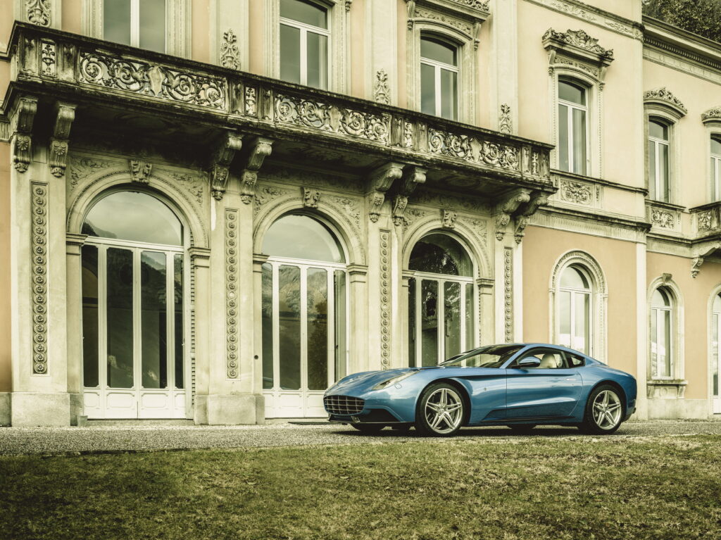Sleek Ferrari Berlinetta Lusso Before Historic Architecture Wallpaper