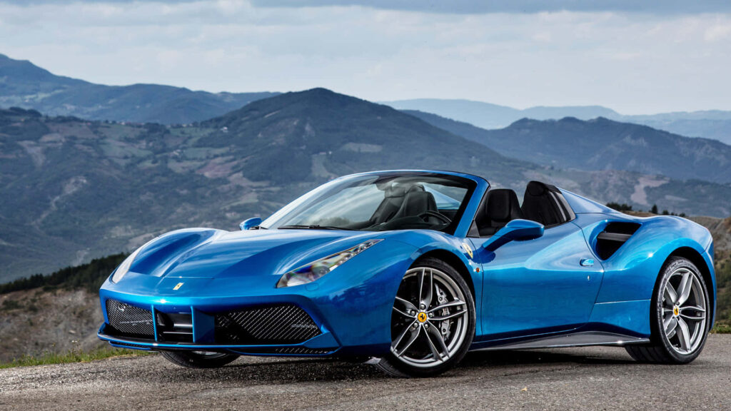 Unleashing the Speed Demon: A Ferrari's Dazzling Dance with the Sun Wallpaper