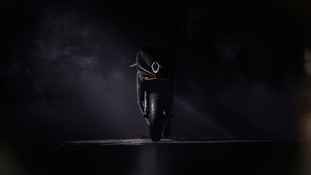 Futuristic Motorcycle Wallpaper: Sleek Design in Dramatic Lighting