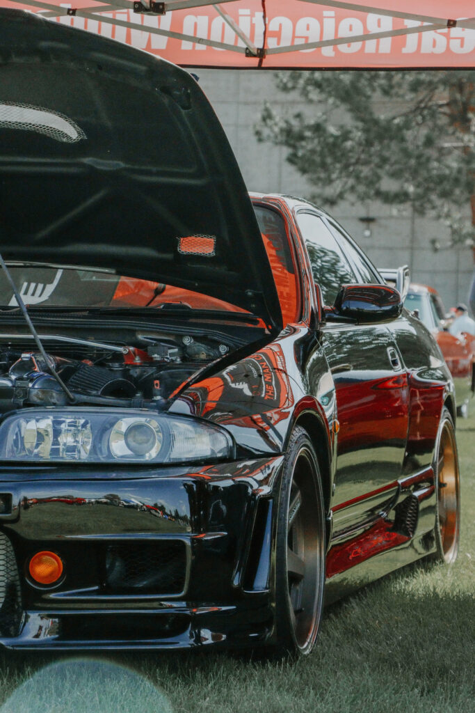 Stunning GTR Wallpaper: Sleek Car with Open Hood & Glossy Black Finish