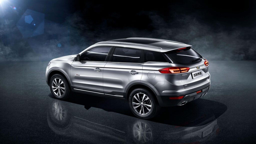 Sleek Geely Luxury Car with Urban City Background – Premium Wallpaper
