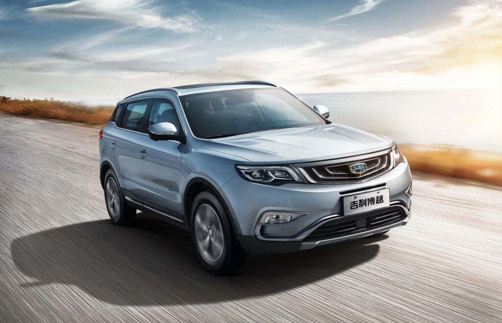 Stunning Geely Vehicle Wallpaper: Sleek Design on Scenic Road