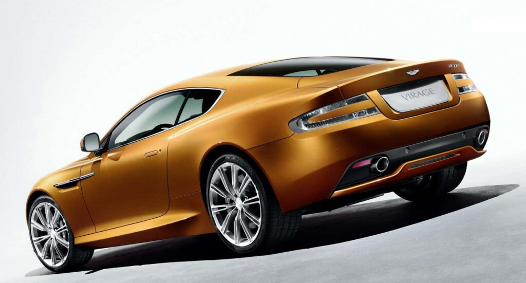 Sleek gold luxury car with modern aerodynamic design in pristine wallpaper background
