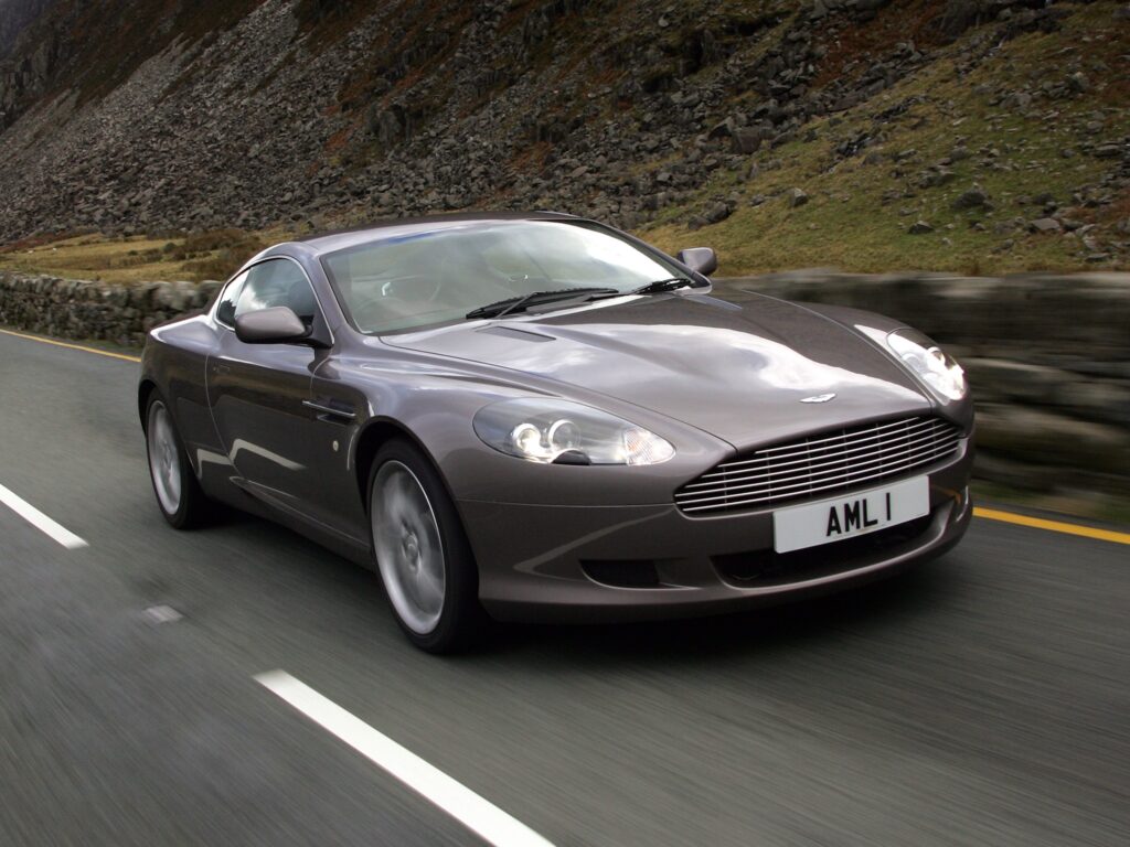 Elegant 2004 Aston Martin DB9: Sleek Gray Wallpaper with Scenic Background