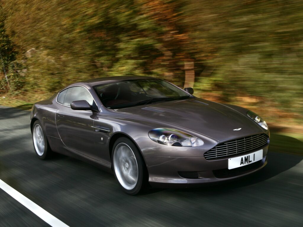 Dynamic Side View of a Sleek Gray 2004 Aston Martin DB9 Wallpaper