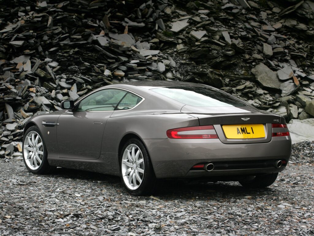 2004 Gray Aston Martin DB9: Elegant Rear View Wallpaper Background