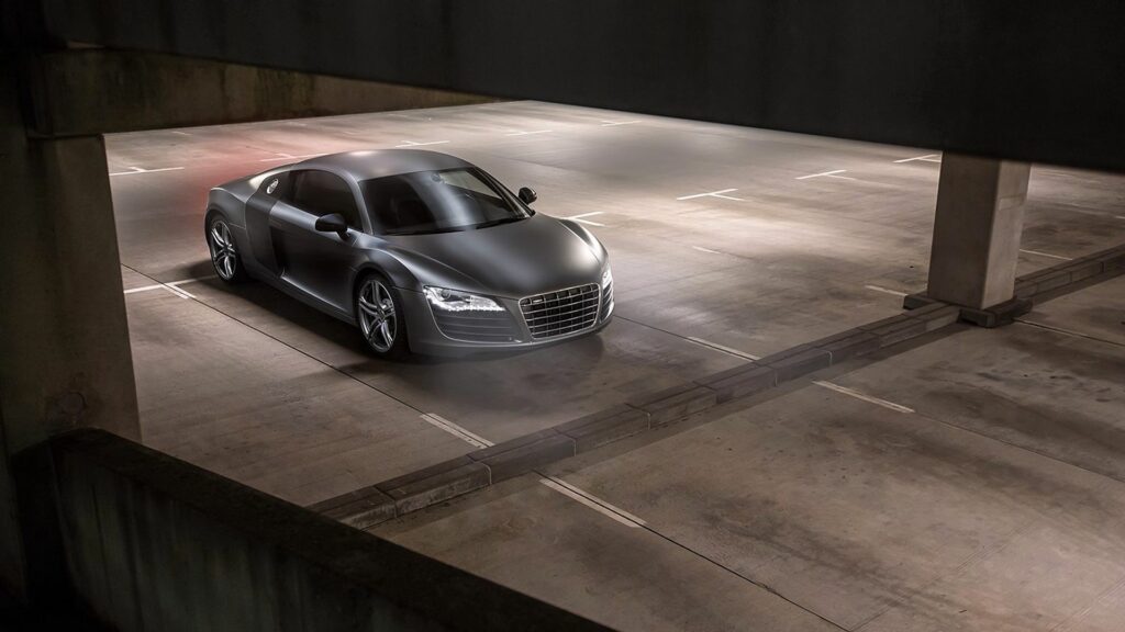 Elegant Gray Audi R8 Side View Wallpaper in Empty Parking Garage
