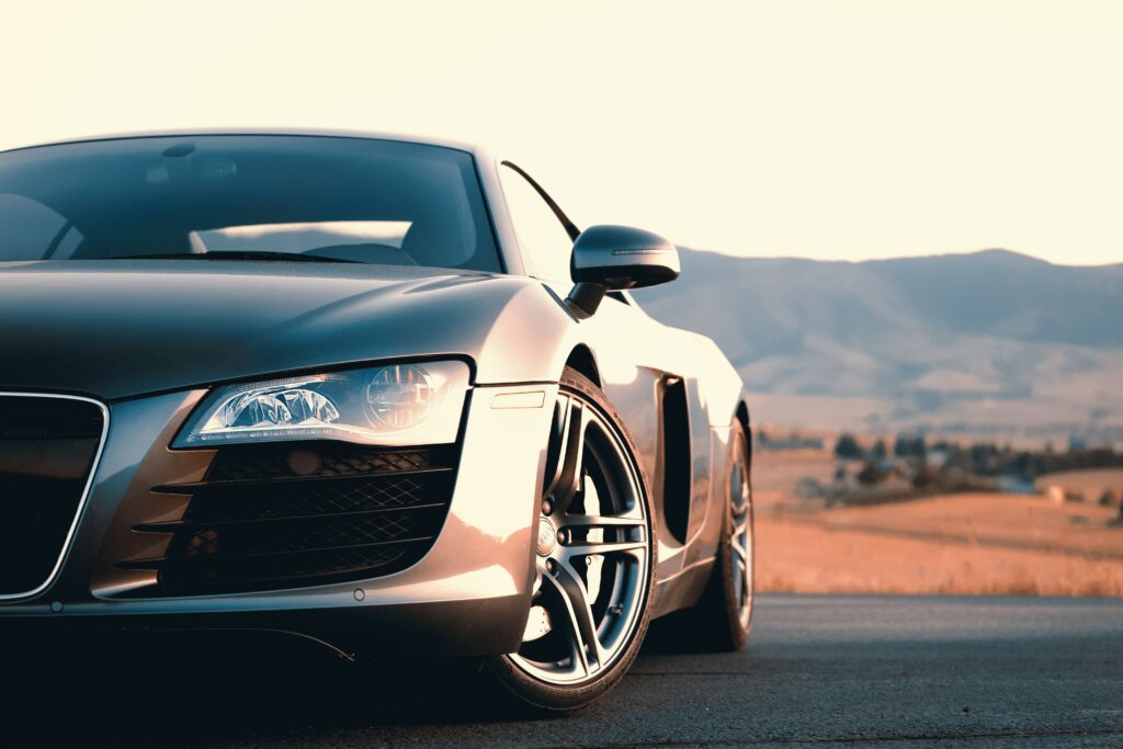 Sleek Gray Audi R8 at Sunset: Dynamic Design & Serene Hills Wallpaper