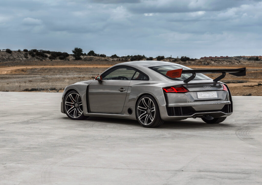 Stylish Gray Audi TT Wallpaper - Sleek Side View with Scenic Background