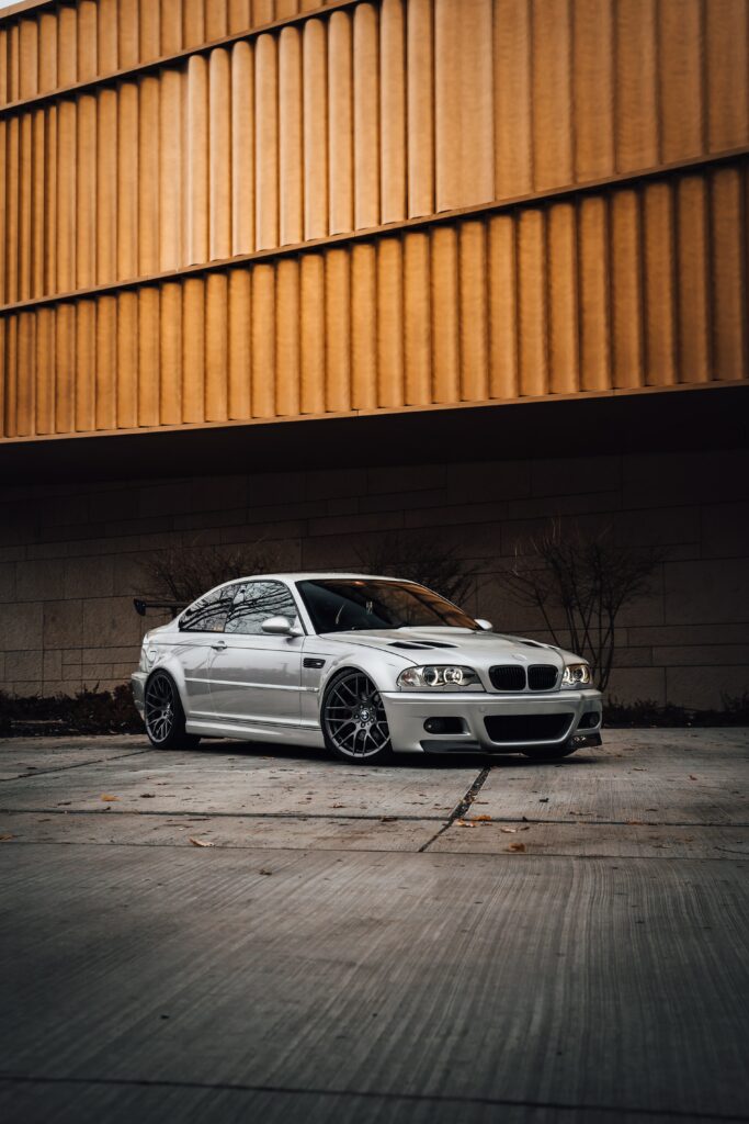 Stylish Gray BMW Side View Wallpaper in Urban Setting