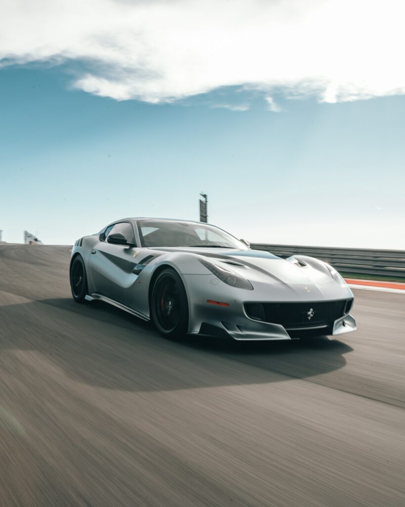 Sleek Gray Ferrari F12 Wallpaper: Speed & Elegance on Track