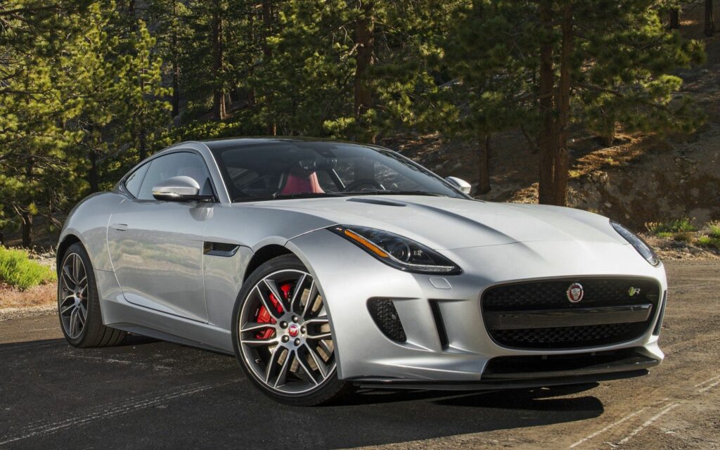 Sleek Gray Jaguar F-Type Wallpaper with Scenic Mountain Background