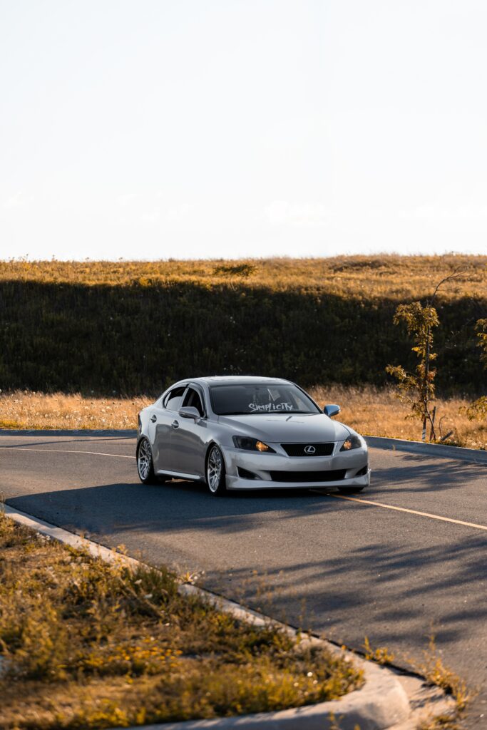 Sleek Gray Lexus on Open Road – Modern Adventure Wallpaper