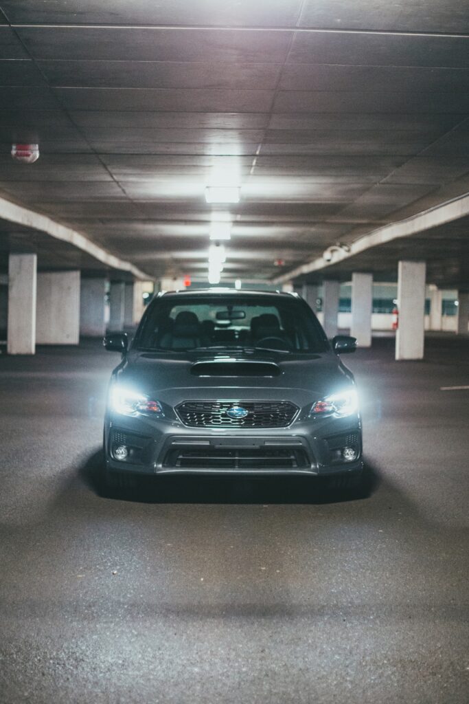 Sleek Gray Subaru in Dim Garage: Modern Sporty Design Wallpaper