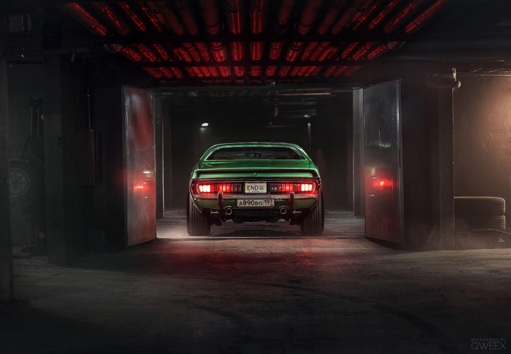Sleek Green Car in Dim Garage: Stunning Rear View & Atmosphere Wallpaper