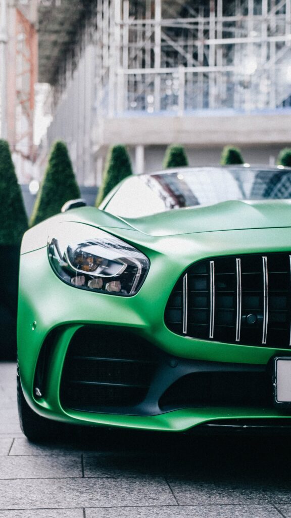 Dynamic Green Supercar Wallpaper: Front View of Luxury Performance
