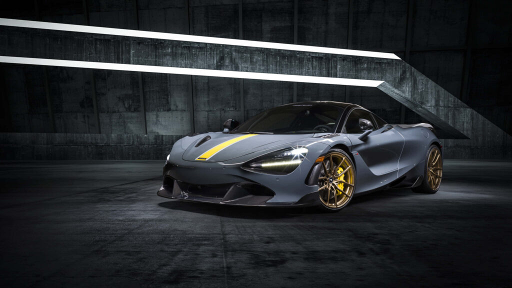 Grey sports car with gold rims in dim modern industrial room with geometric ceiling lights wallpaper