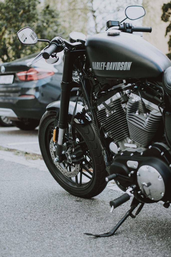 Sleek Harley-Davidson Cruiser Motorcycle Wallpaper in Scenic Mountains