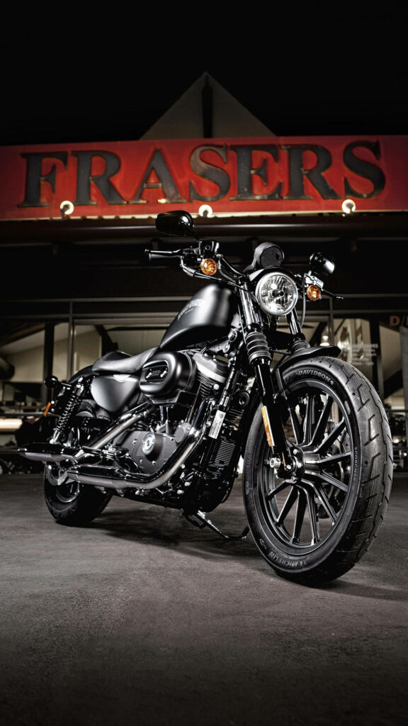 Sleek Harley Davidson Mobile Wallpaper Under Dramatic Lighting