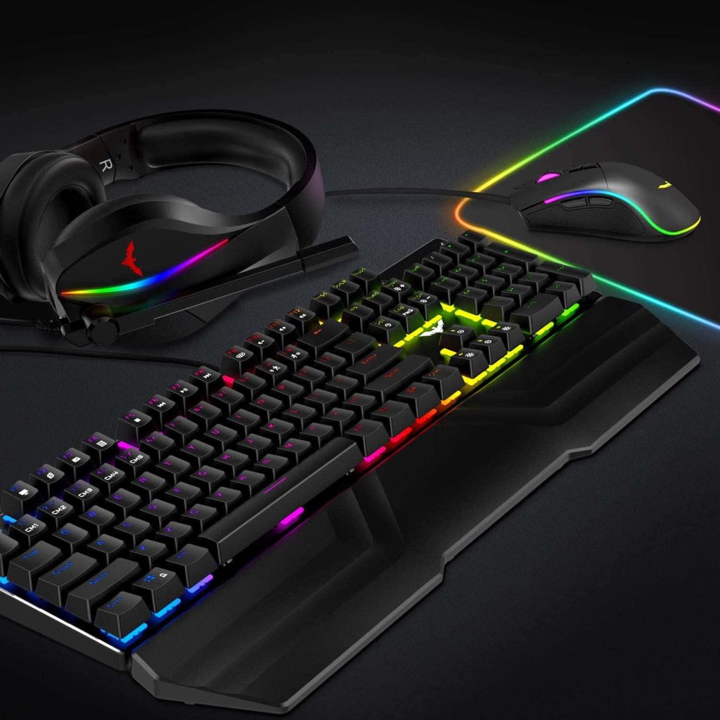 RGB backlit mechanical keyboard wrist rest ergonomic gaming mouse neon headset on dark background Wallpaper