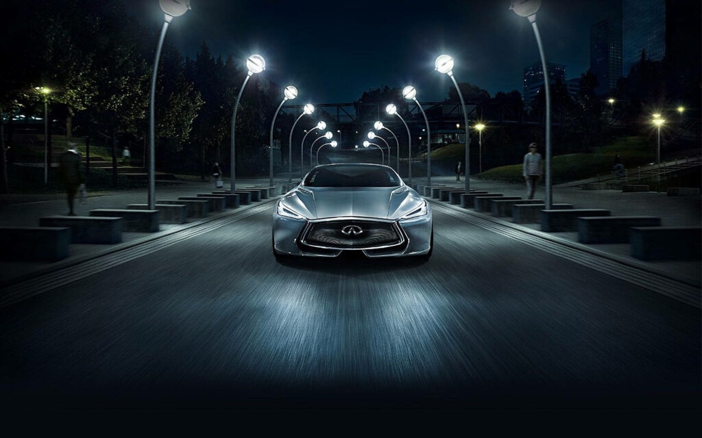 Futuristic Infiniti Car Wallpaper: Nighttime Urban Highway Scene
