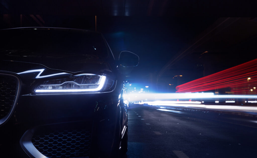 Sleek Jaguar F-Pace Close-Up: Nighttime Elegance & Speed Wallpaper