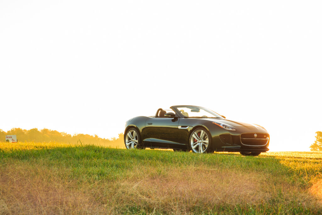 Sleek Jaguar F-Type V8 S Convertible in Serene Sunset Landscape Wallpaper