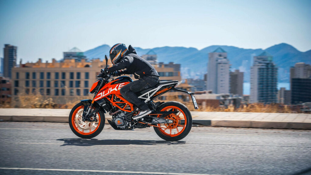 Vibrant Townscape with Sleek KTM Duke 390 - Urban Wallpaper