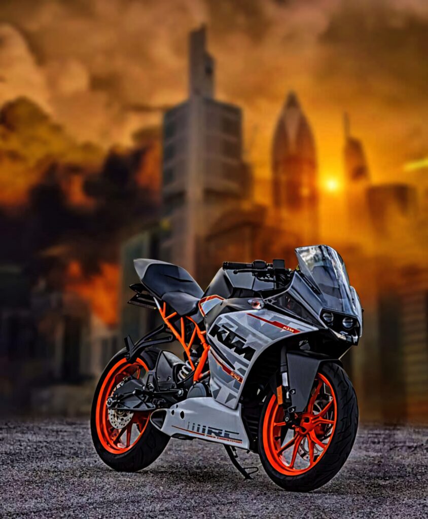 Dynamic KTM Motorcycle in Urban Sunset - Bold Wallpaper Background