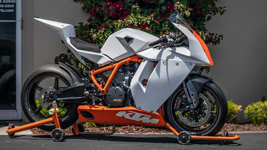 Sleek KTM Motorcycle Wallpaper: Sporty White & Orange Design