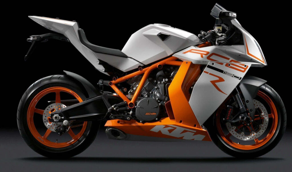 Sleek KTM RC8 Wallpaper: Bold Orange & White Sports Motorcycle