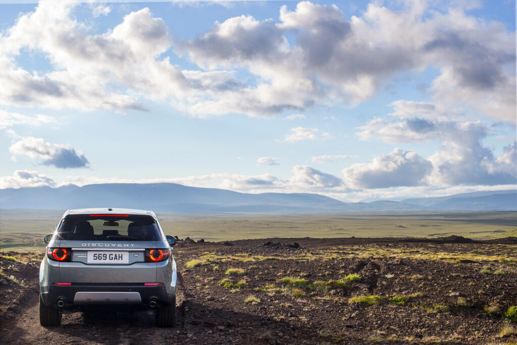 Adventure Awaits: Silvery Land Rover Discovery Wallpaper Background
