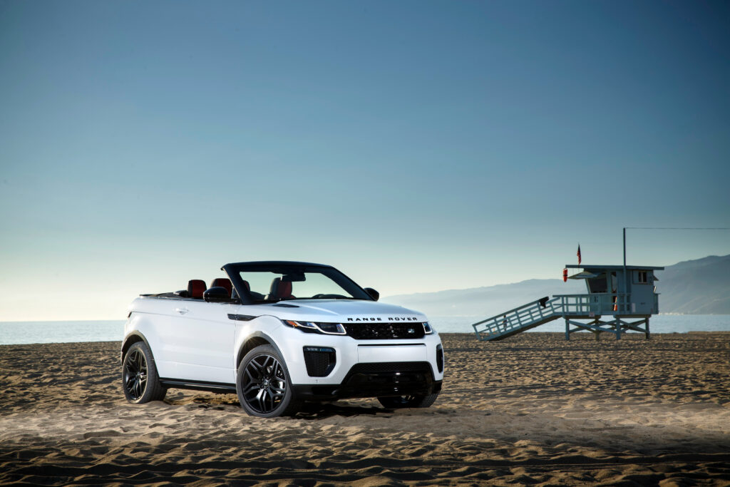 Elegant Land Rover Range Rover Evoque at Stunning Beach - Side View Wallpaper