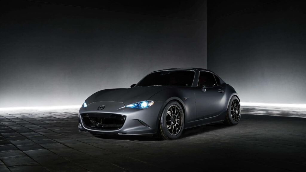 Sleek Mazda Miata Wallpaper: Sporty Elegance on Dark Minimalist Design