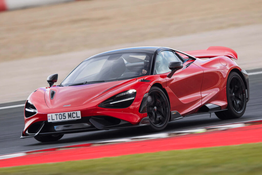 Sleek McLaren Wallpaper: High-Speed Automotive Masterpiece Background