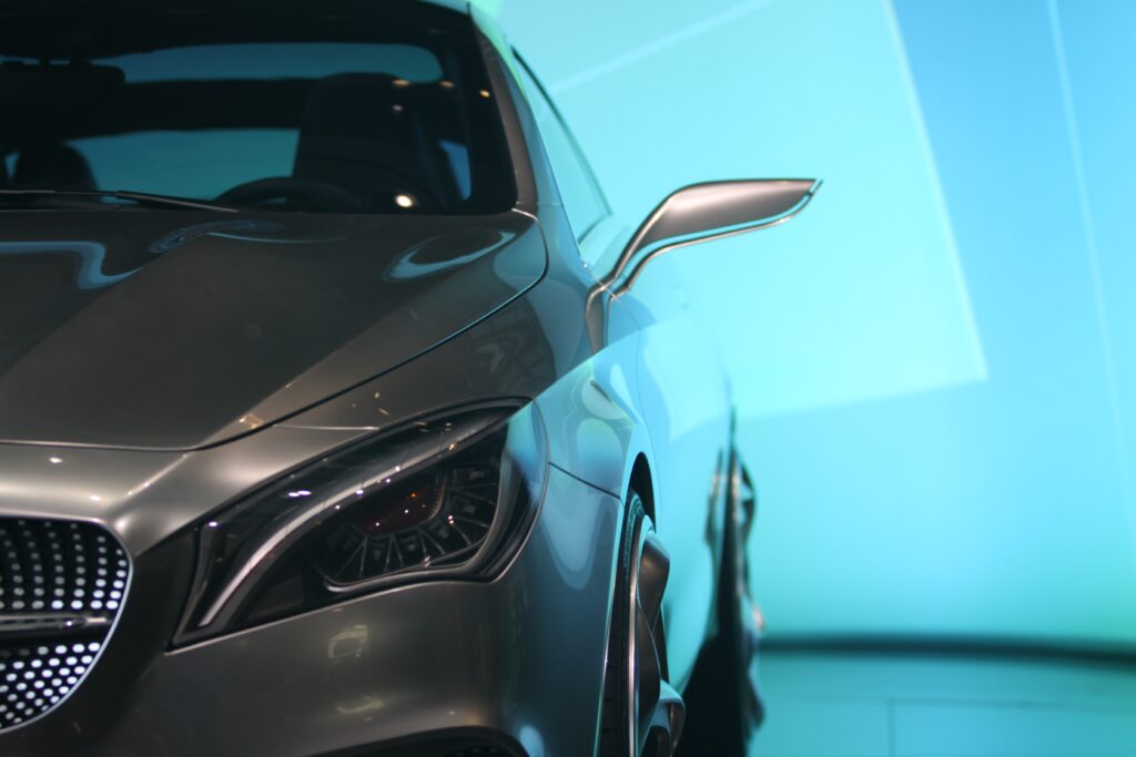 Sleek Mercedes-Benz Front Bumper & Grille on Minimalist Background Wallpaper