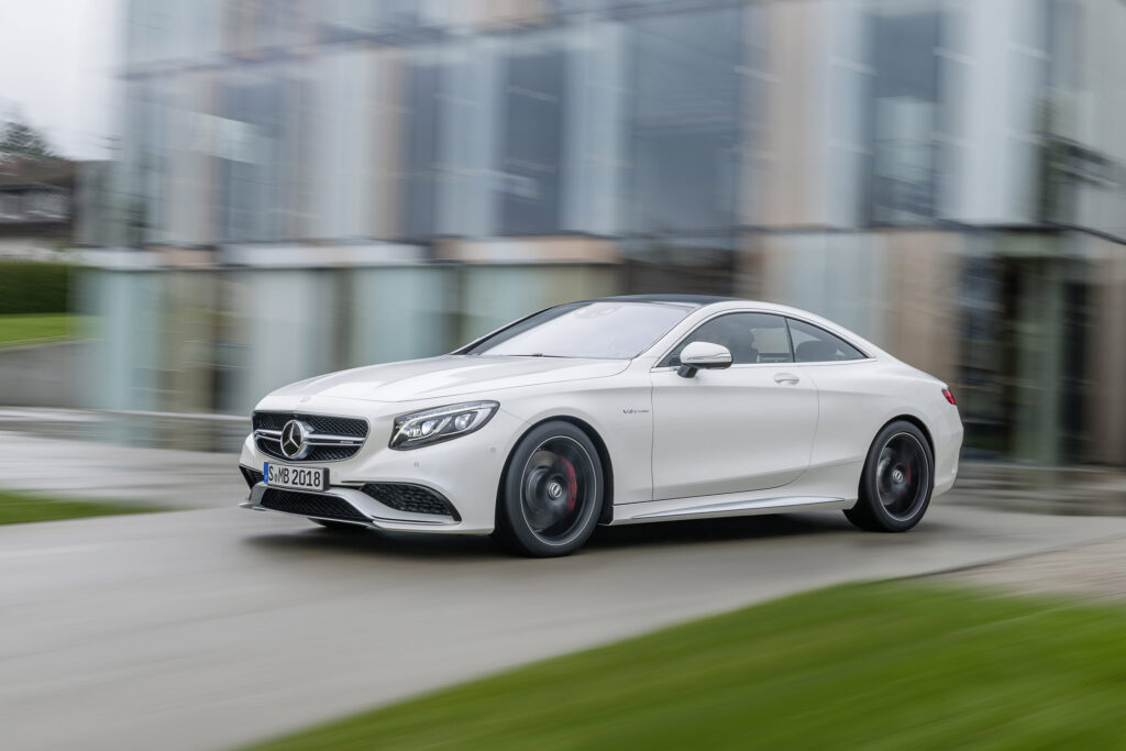 Sleek Mercedes-Benz S63 AMG Coupe in Dynamic Luxury Background Wallpaper