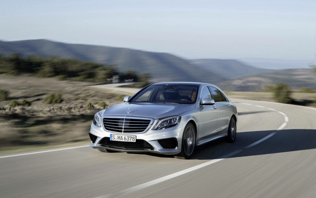 Luxury Mercedes-Benz in Scenic Wallpaper: Graceful Performance Drive
