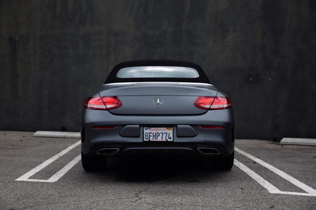 Sleek Mercedes Convertible Poster: Elegant Design & Rear Lights Wallpaper