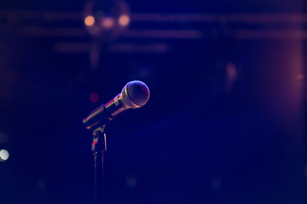 Sleek Microphone Wallpaper: Live Performance Ambiance Background