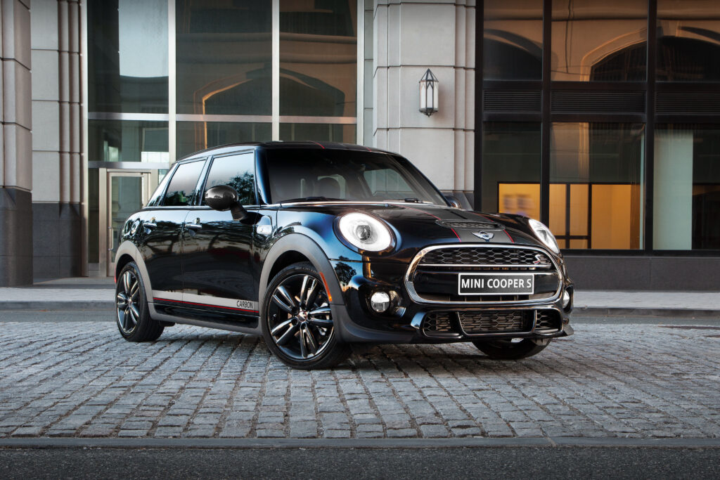 Sleek Mini Cooper S F56 Side View Wallpaper in Urban Setting