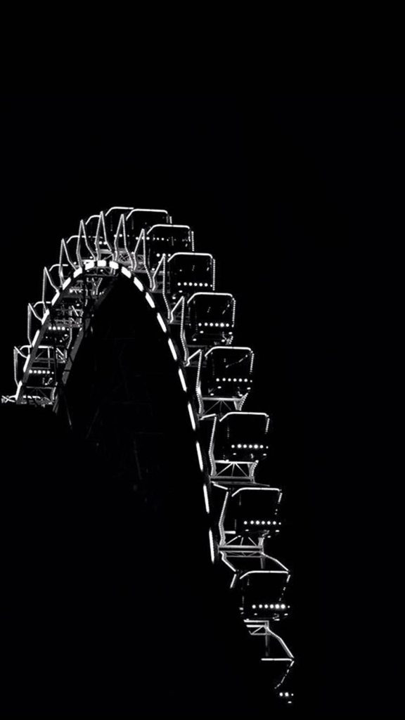 Minimalist Ferris wheel segment glowing against black night sky monochrome wallpaper background