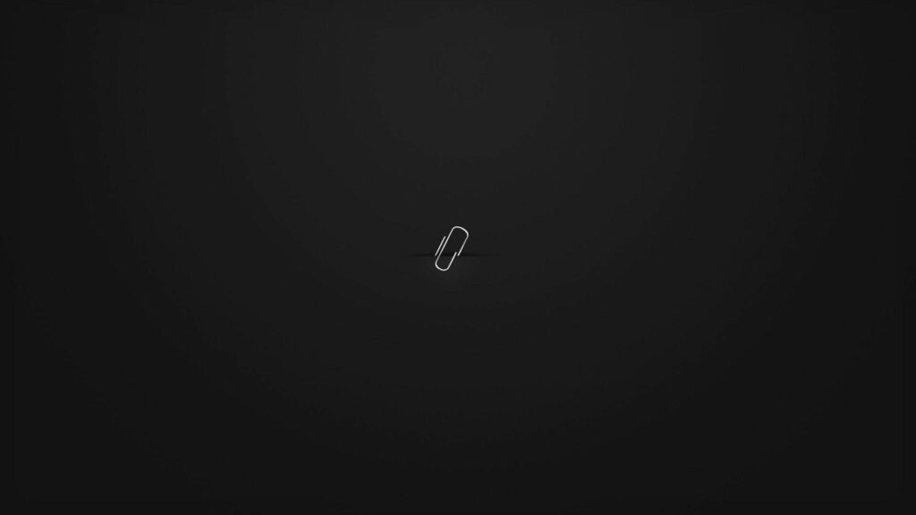 Minimalist Laptop Wallpaper: Elegant White Paper Clip on Dark Background