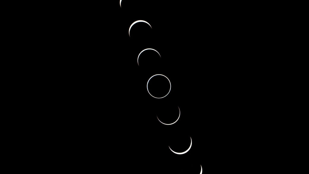 Sleek Moon Phases Wallpaper: Minimalist Dark Aesthetic Background